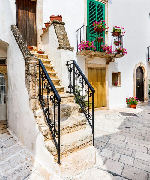 Locorotondo, Italy. Medieval whitewashed street and houses in small city of Puglia, Apulia, Bari region.